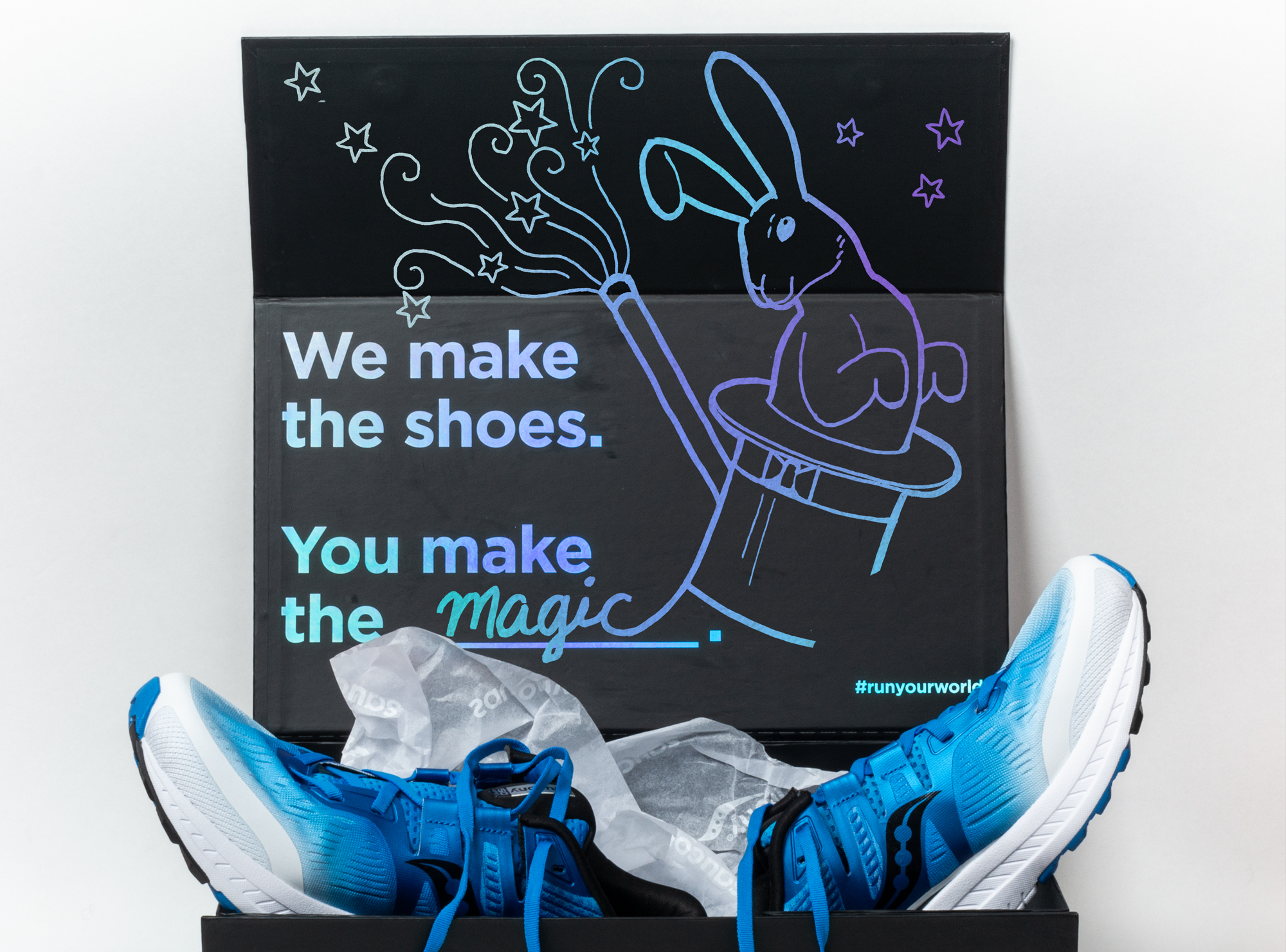 Saucony Ride ISO shoebox illustration of a rabbit and top hat